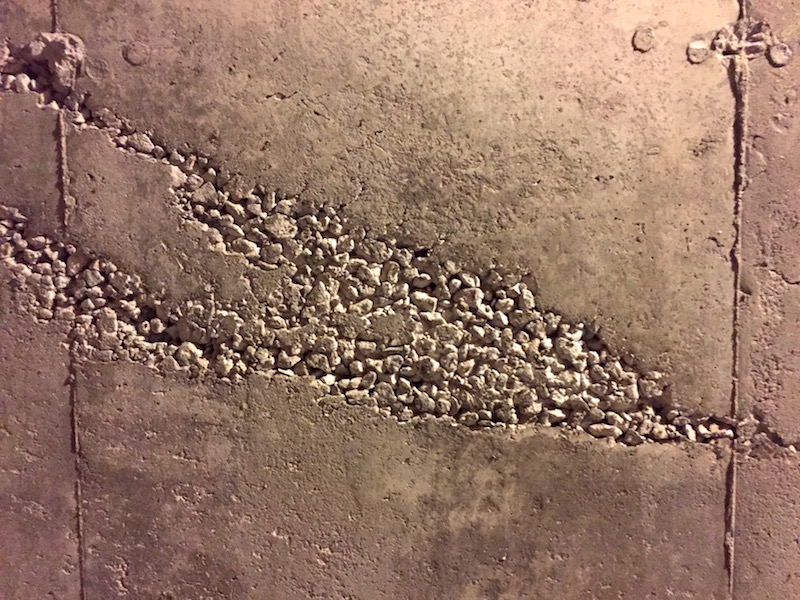 Concrete wall with aggregate visible