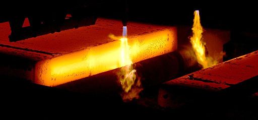Oxygen cutting a steel slab in continuous casting